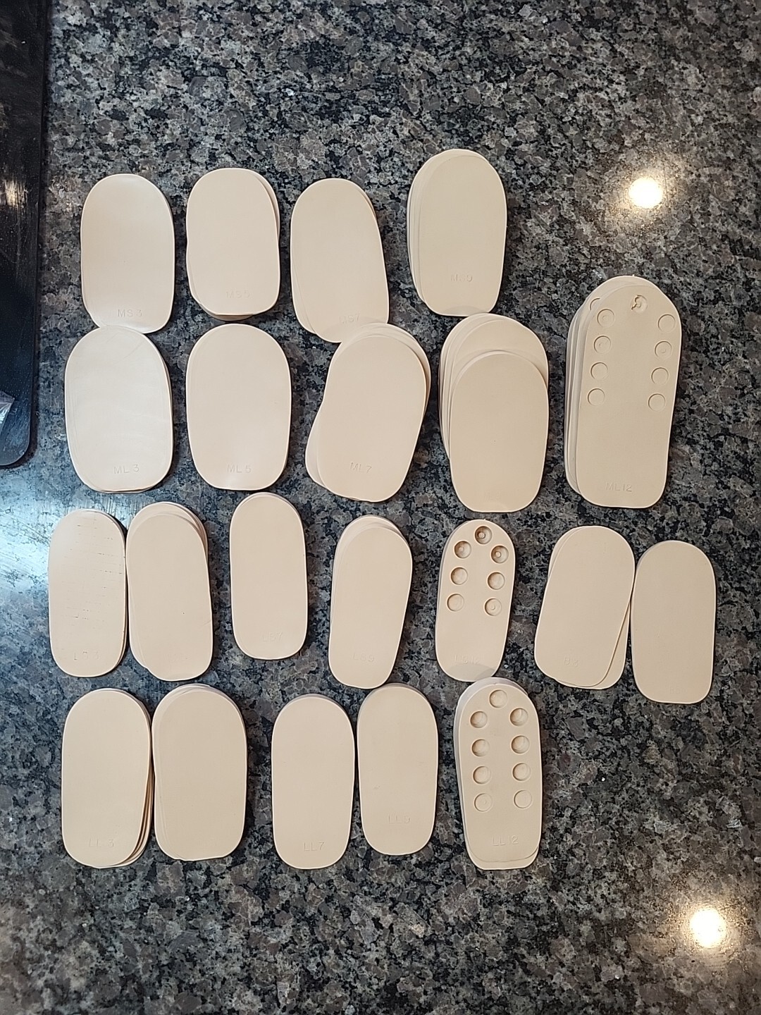 Lot of 71 new Rubber Heel Lifts by G & W Heel lifts cream colored various sizes