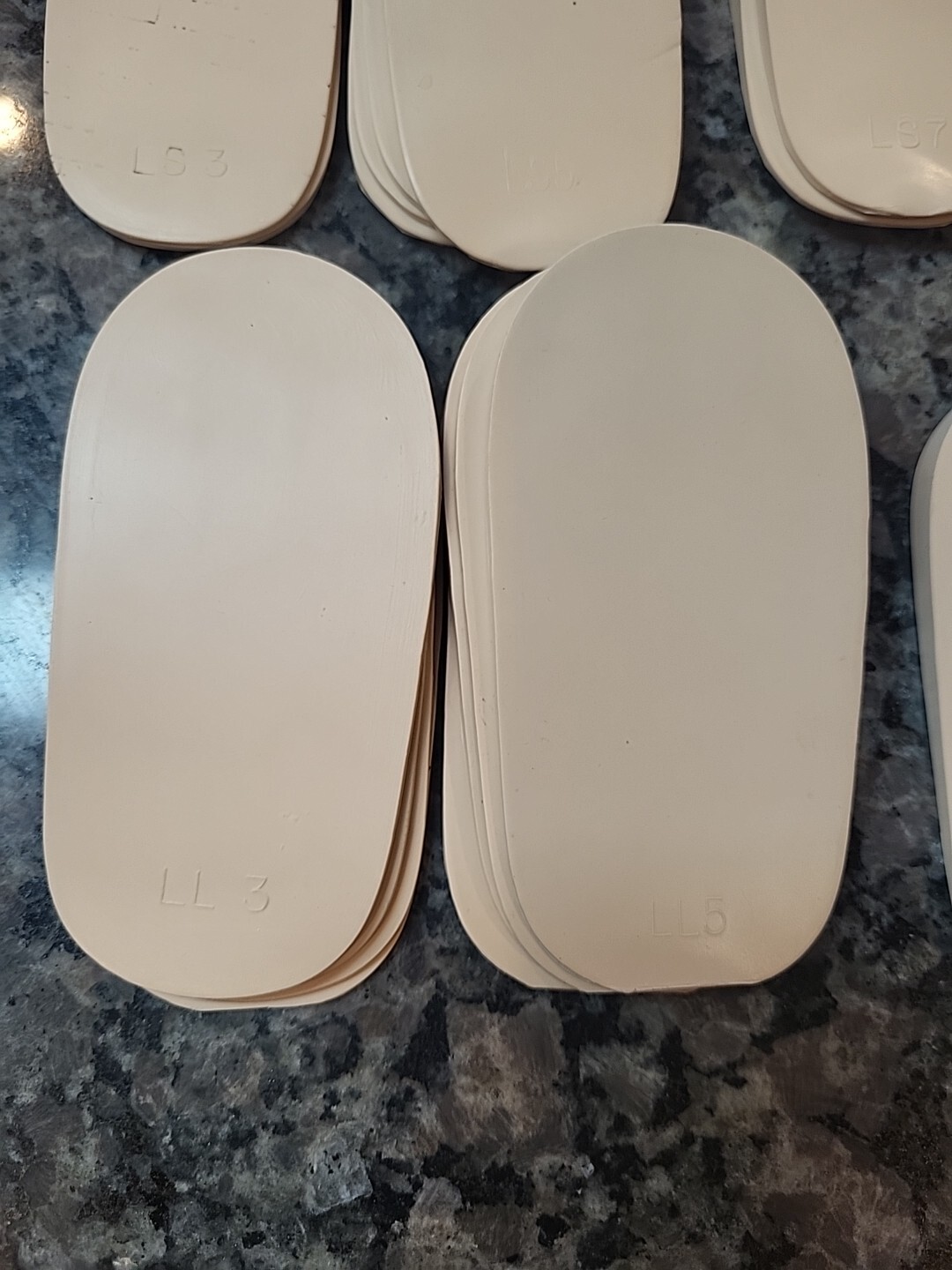 Lot of 71 new Rubber Heel Lifts by G & W Heel lifts cream colored various sizes